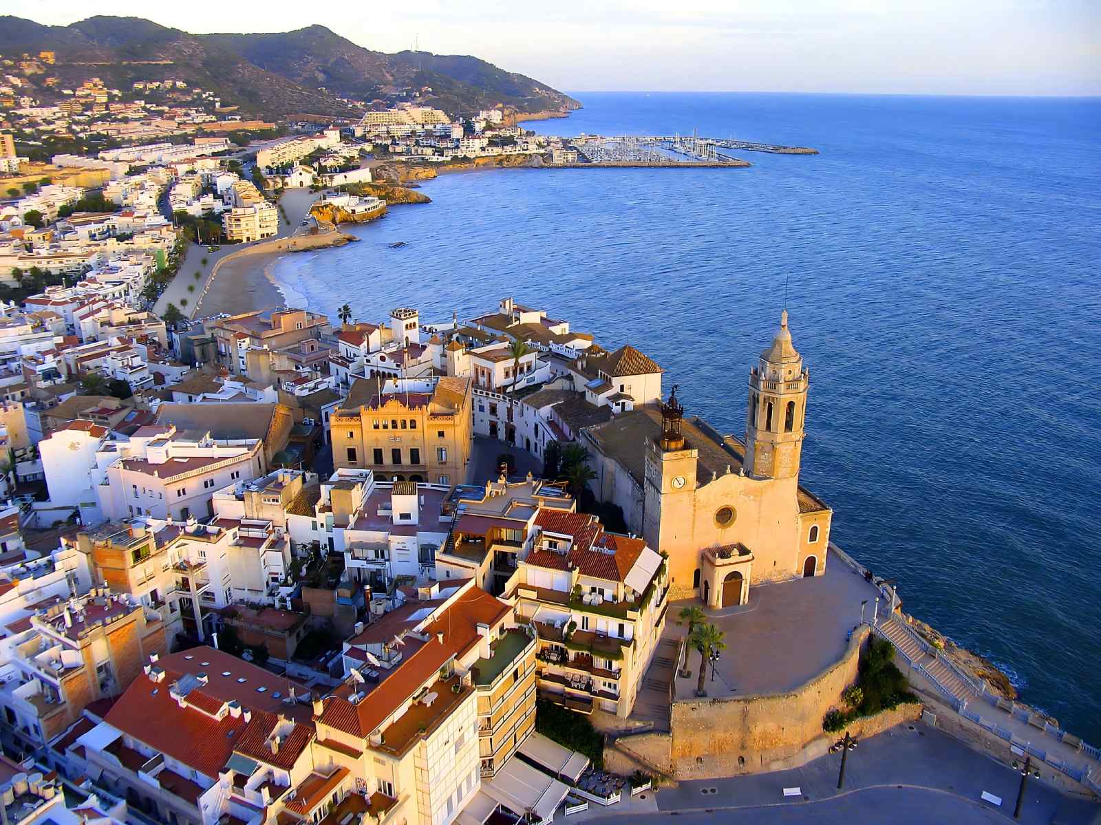 Sitges from above, with the old town, the Church of Sant Bartomeu i Santa Tecla and the marina